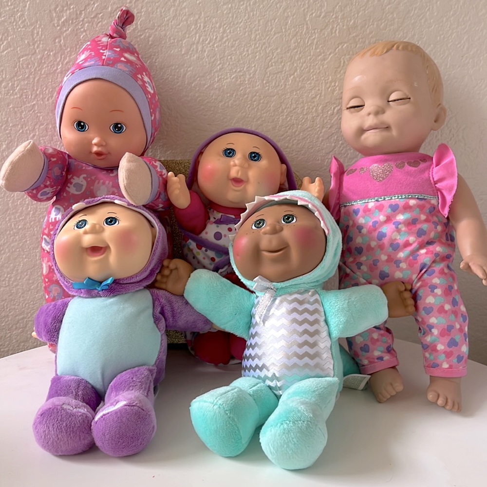 5 baby  dolls including 3 cabbage patch.